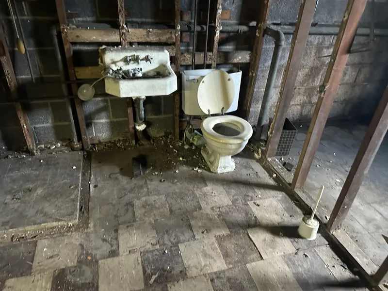 Hackensack, NJ bathroom remodel: before: stripped to the framing and block walls